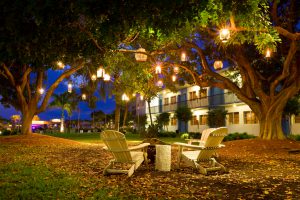 Summer resort with lanterns and lounge chairs